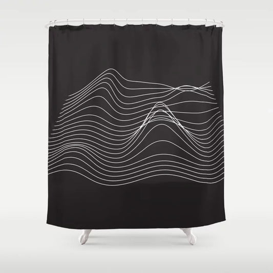 A black shower curtain with a white abstract wave pattern.