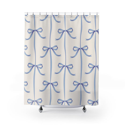 A shower curtain with a pattern of blue bows on a white background.