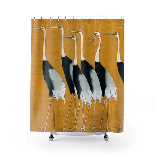 A shower curtain featuring a pattern of several birds, possibly cranes, in profile against a yellow background.