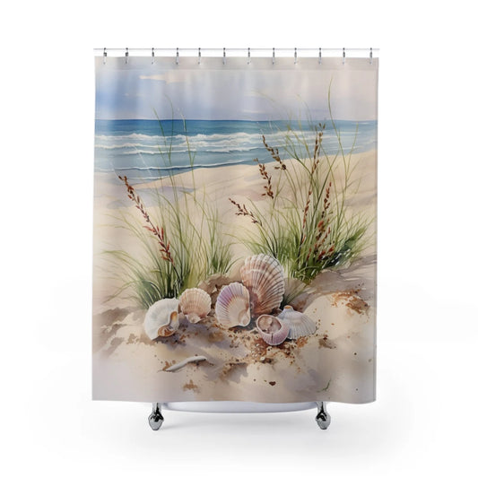 A shower curtain with a beach and seashells design, featuring a serene beach scene with sand dunes and a blue sky.
