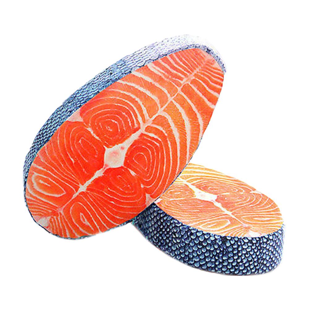 A plush toy pillow designed to resemble a slice of salmon, with realistic detailing in orange and blue shades.